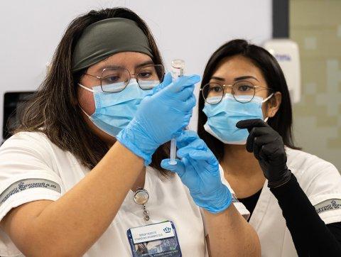 Nursing student with instructor